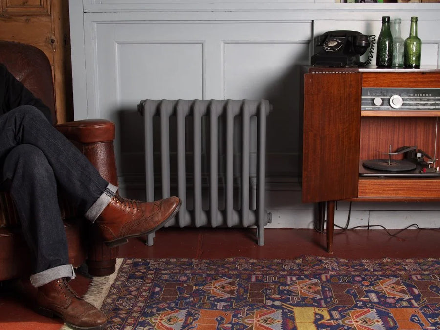 Renovated salvaged old school cast iron radiator...and Andrew's foot