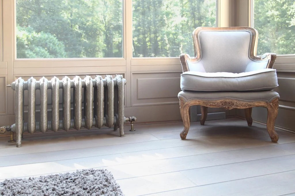 beautiful ornate under bay window cast iron radiator finished in Pearl Beige